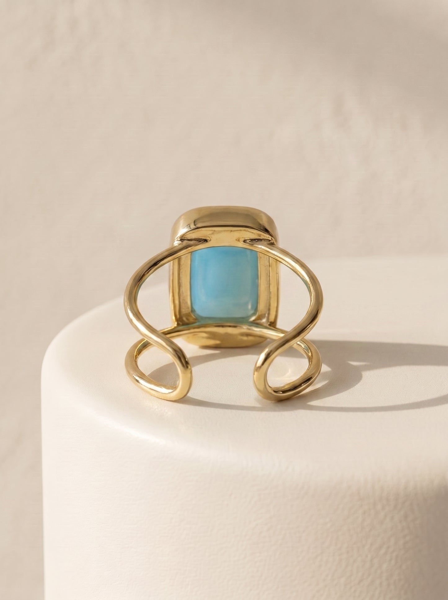 StoneCraft Jewellery aqua agate cushion cuff ring gold plated back view on white surface