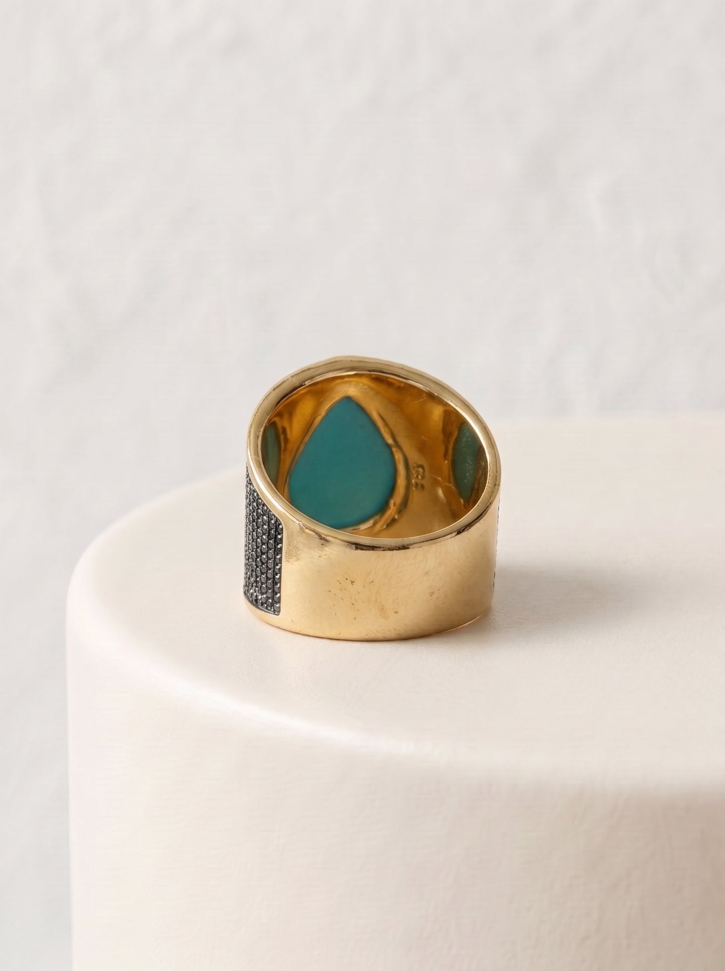 StoneCraft Jewellery green quartz teardrop wide band ring gold rhodium plated back view on white surface