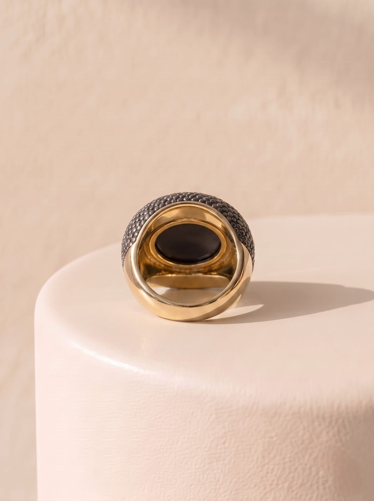 Back view of StoneCraft Jewellery smoky obsidian ring showing the gold-plated band and open-backed setting