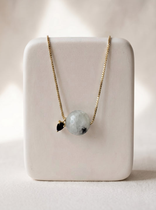 StoneCraft Jewellery - Black rutile quartz slide necklace on a white ceramic jewellery stand