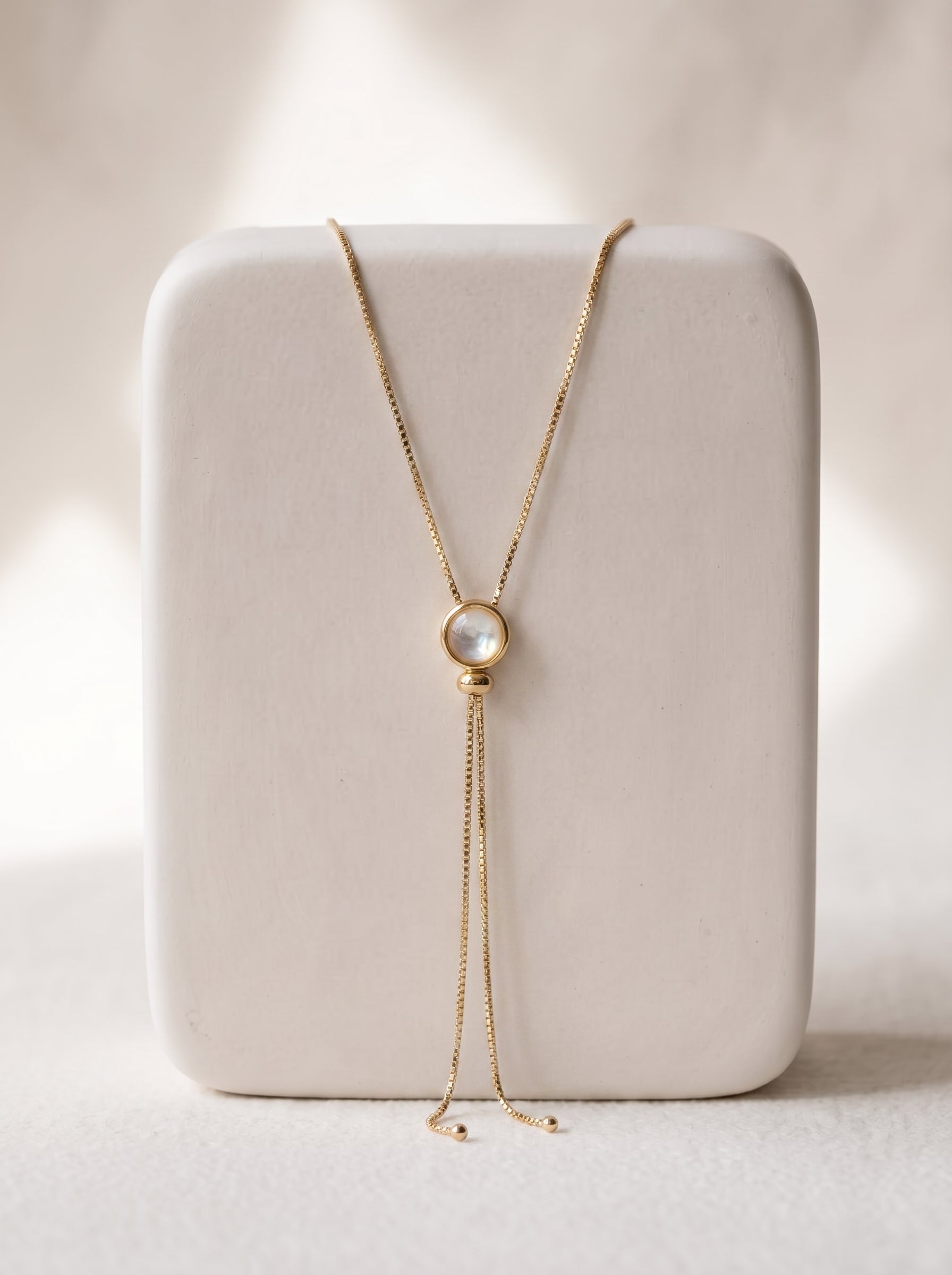 Opalite Lariat Slide Necklace gold-plated on white display stand showing full chain and pendant drop — StoneCraft Jewellery