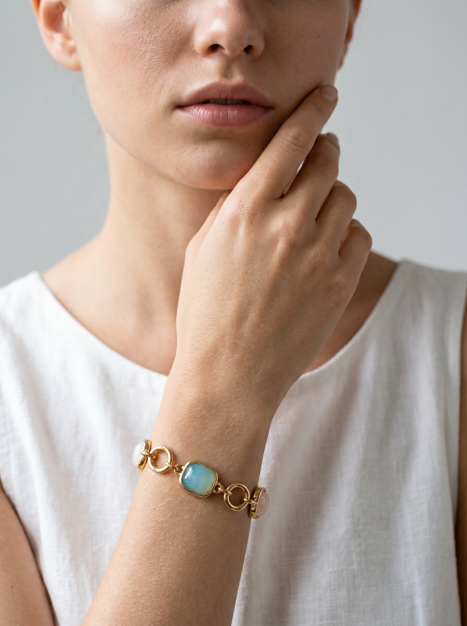 Close-up of rose quartz, agate and amazonite in gold bezel settings — StoneCraft Jewellery