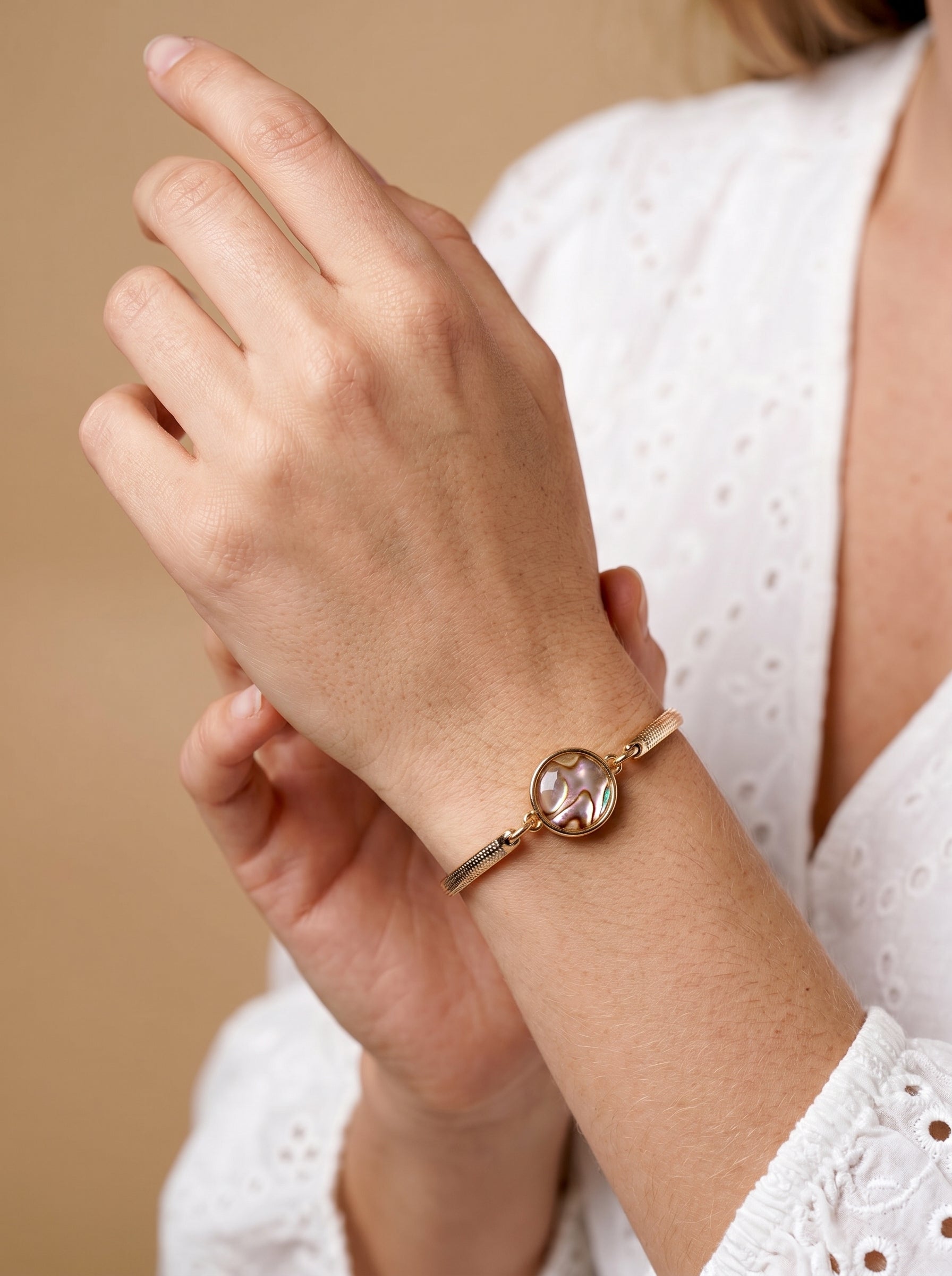 
Iridescent abalone bracelet on wrist, lifestyle shot — StoneCraft Jewellery