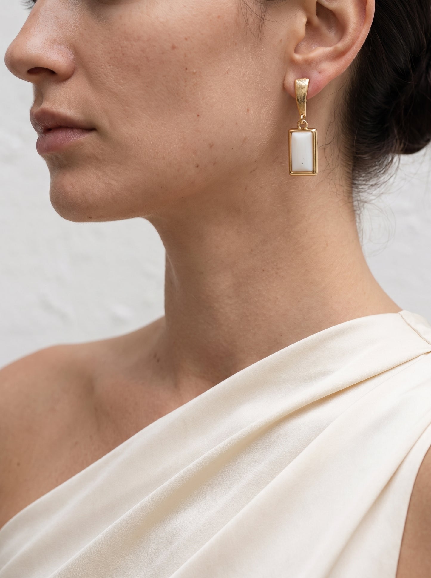 Mother-of-Pearl Rectangle Drop Earrings worn on model, three-quarter view showing full drop length