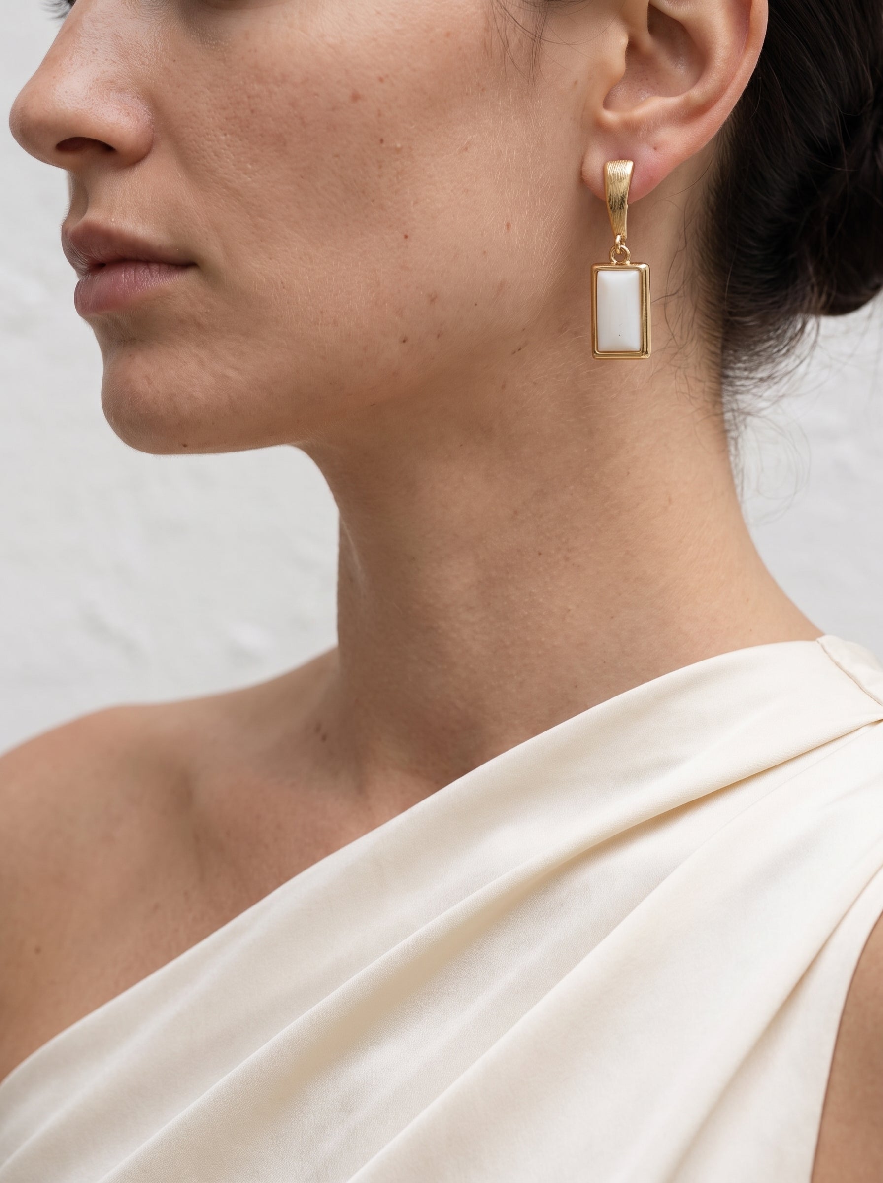 Mother-of-Pearl Rectangle Drop Earrings worn on model, three-quarter view showing full drop length