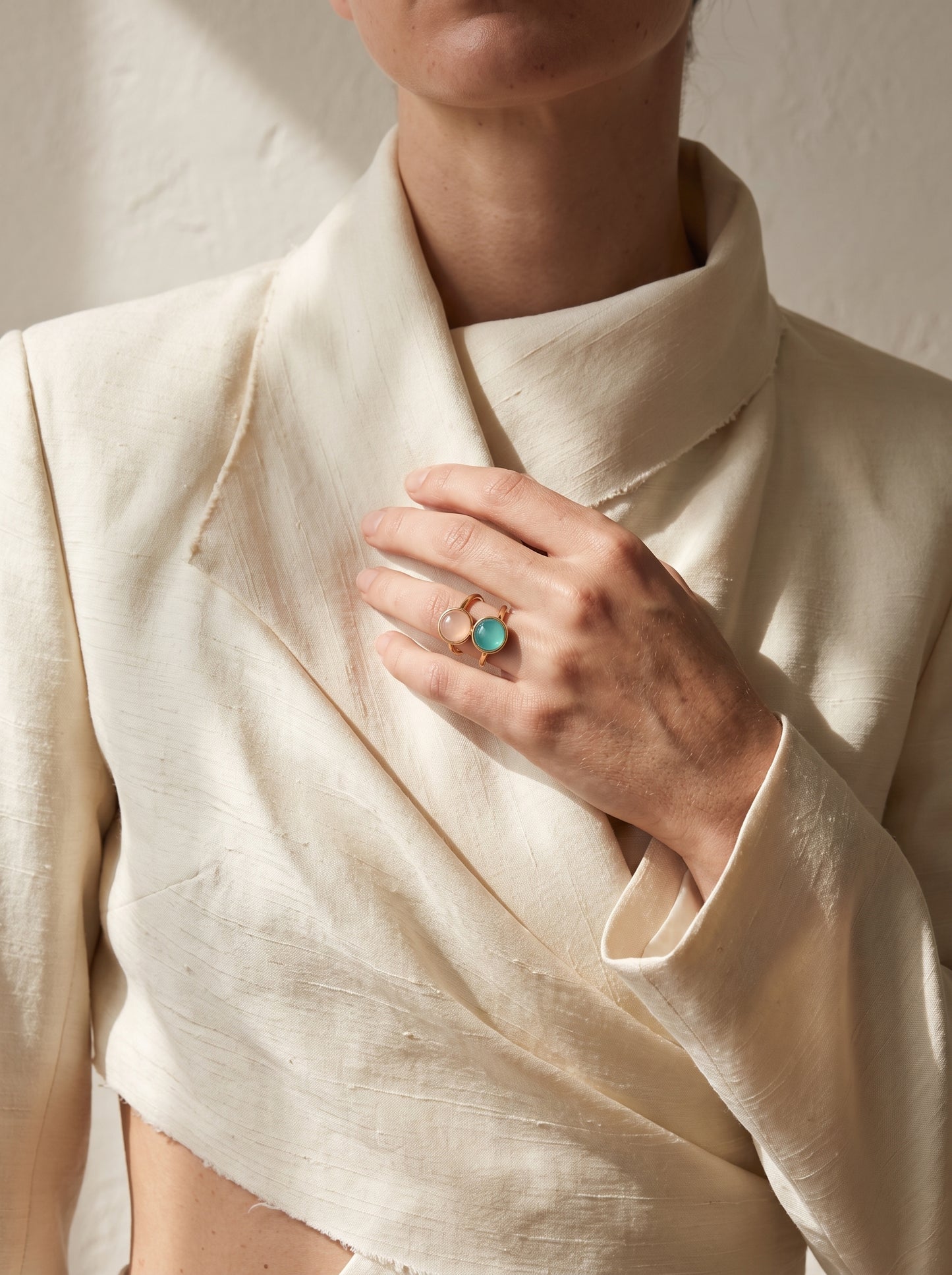 Woman wearing StoneCraft Jewellery dual stone aqua agate and rose quartz gold plated ring on hand