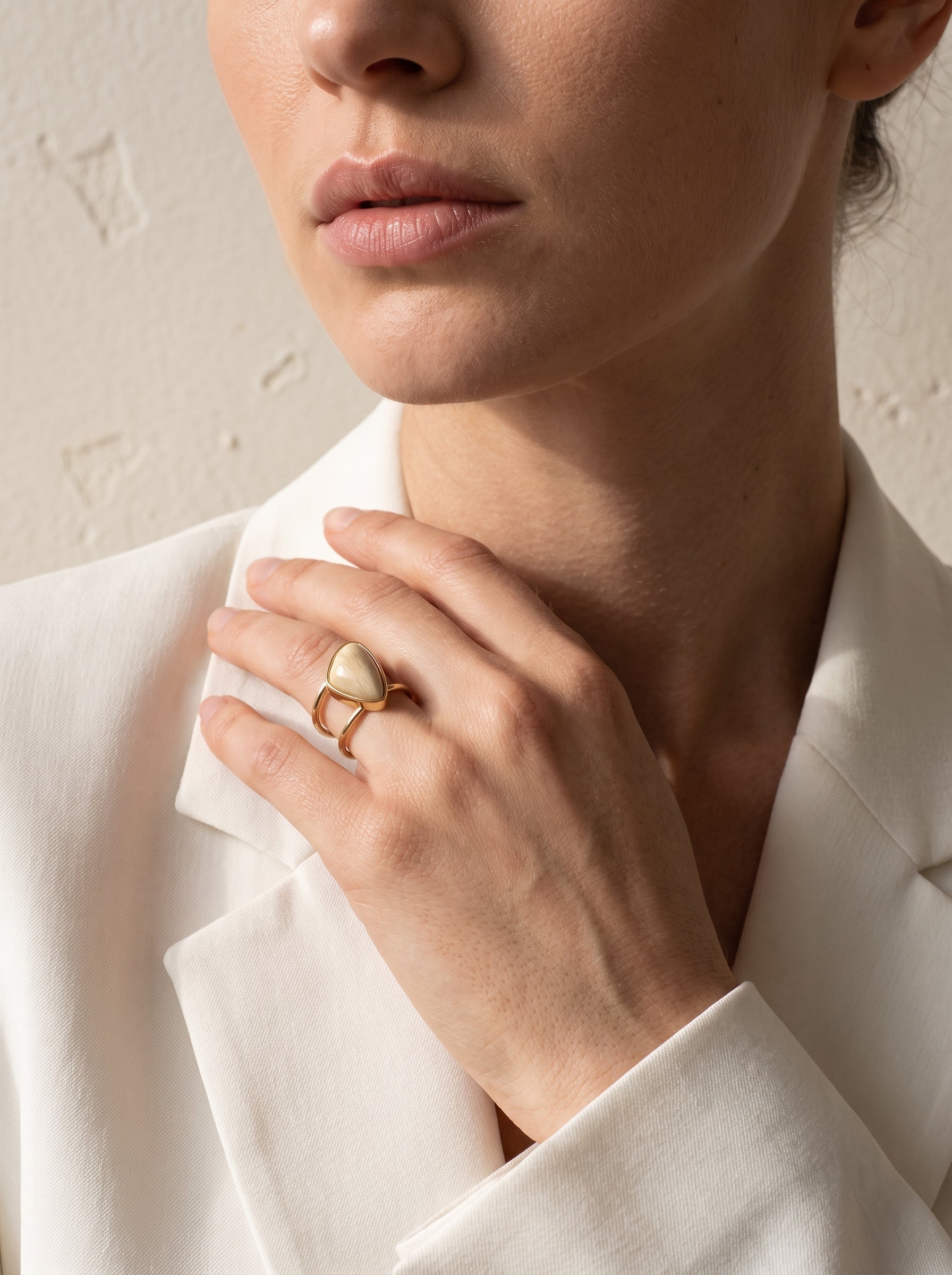 close-up of beige amazonite asymmetric cuff ring worn on hand, gold-plated double band – StoneCraft Jewellery