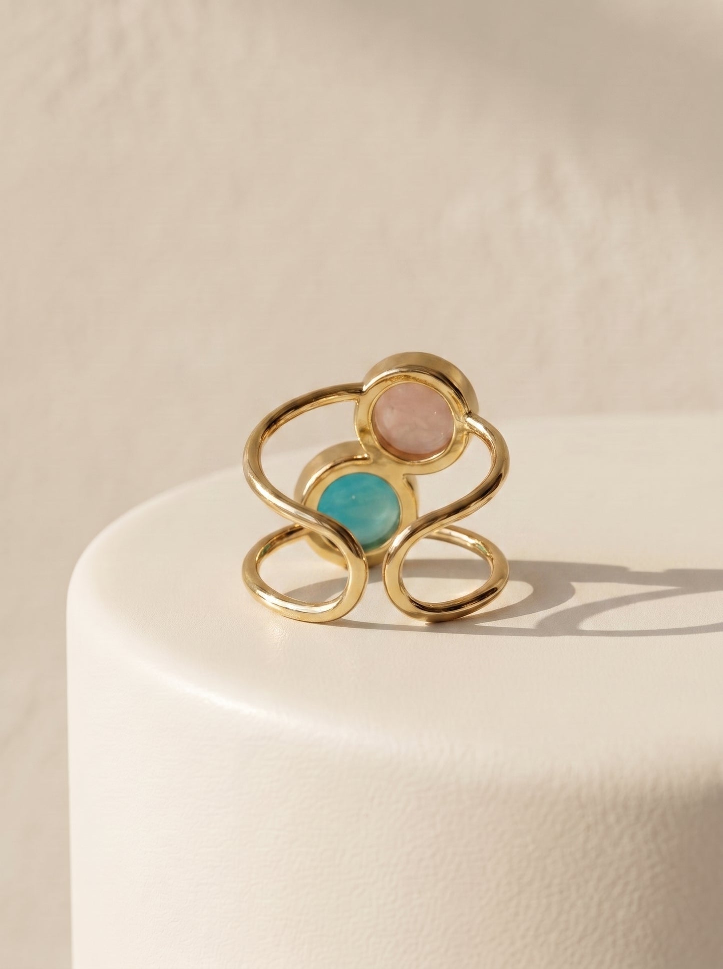 StoneCraft Jewellery dual stone aqua agate and rose quartz gold plated ring back view on white surface