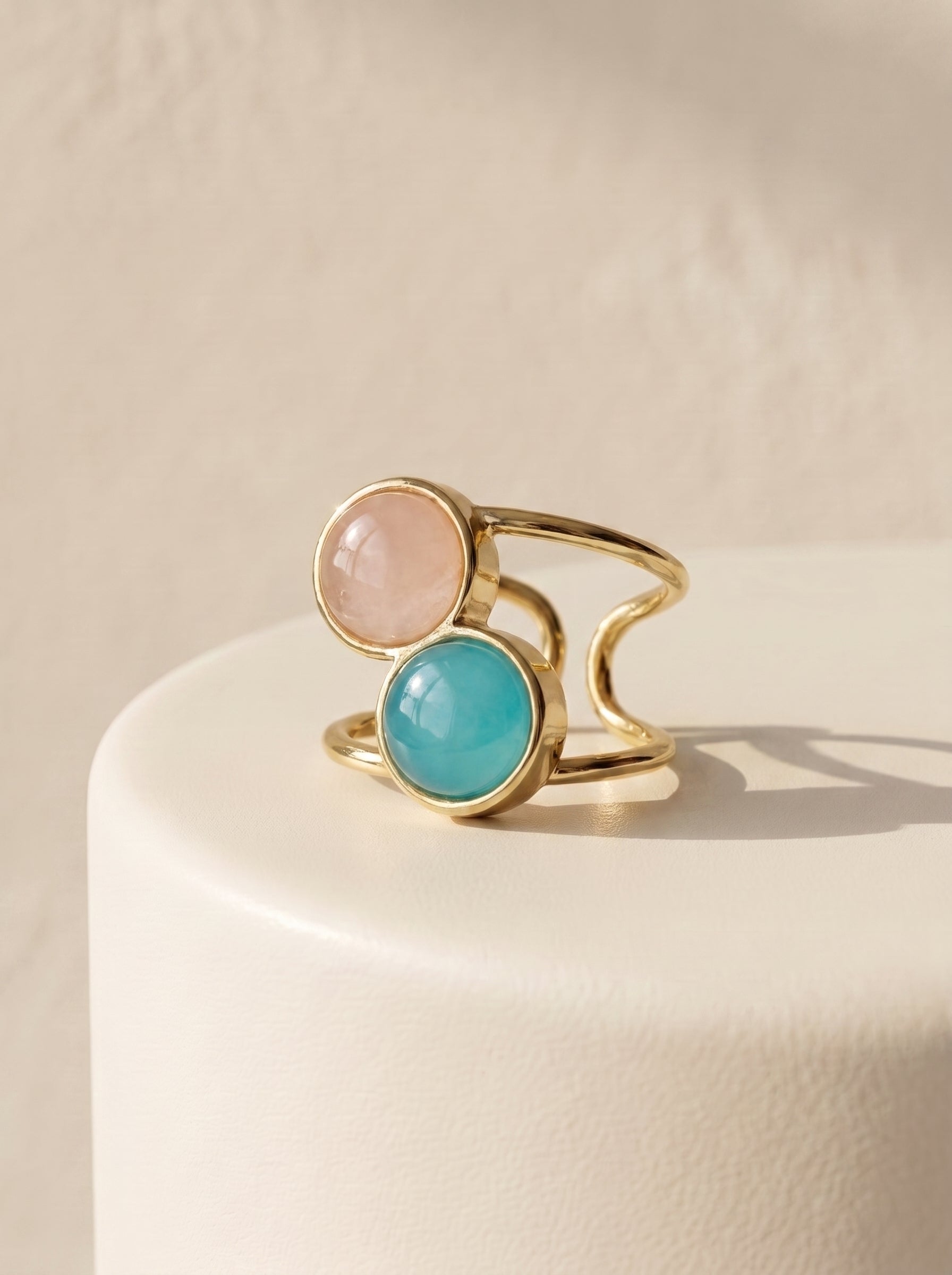 StoneCraft Jewellery dual stone aqua agate and rose quartz gold plated ring front view on white surface