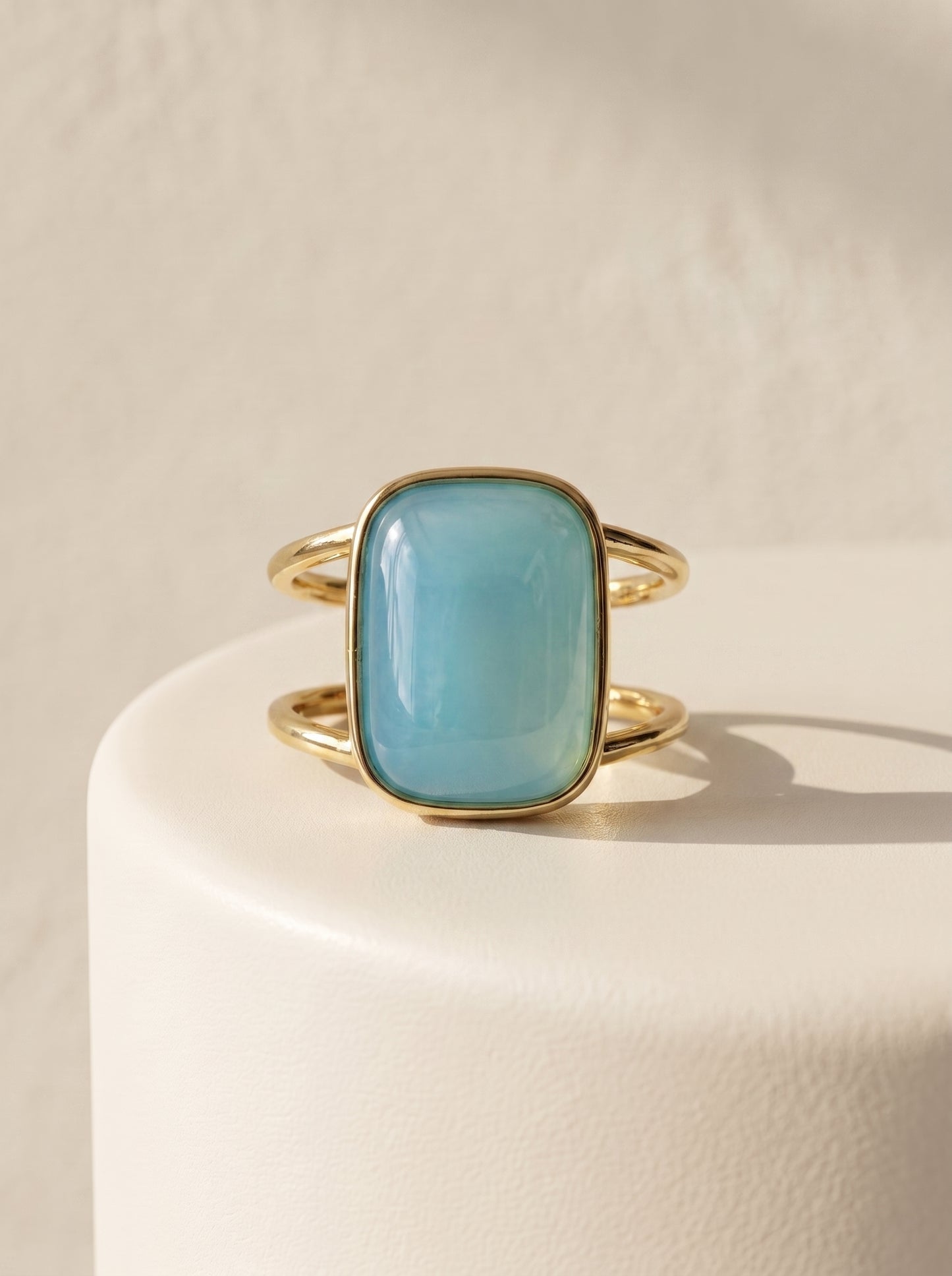 StoneCraft Jewellery aqua agate cushion cuff ring gold plated front view on white surface