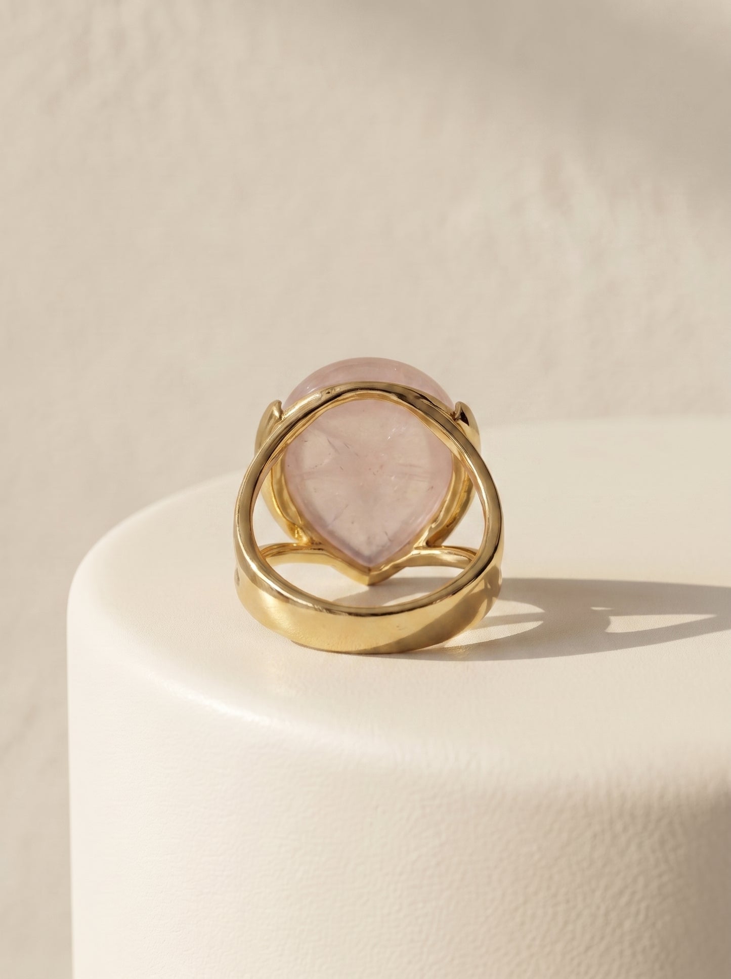 StoneCraft Jewellery rose quartz teardrop gold plated ring back view on white surface