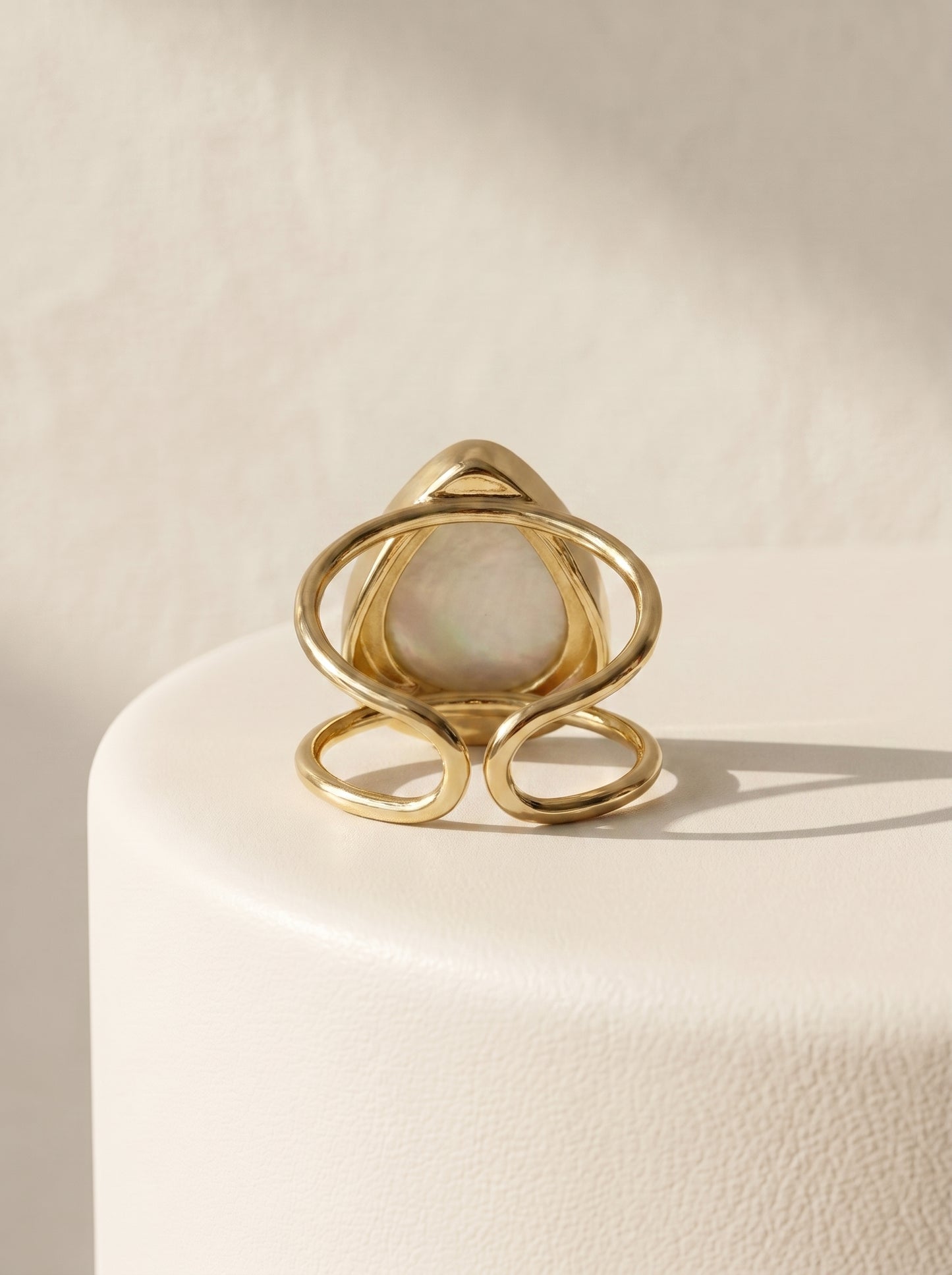Mother-of-Pearl Teardrop Adjustable Ring back view showing gold double band on white display — StoneCraft Jewellery