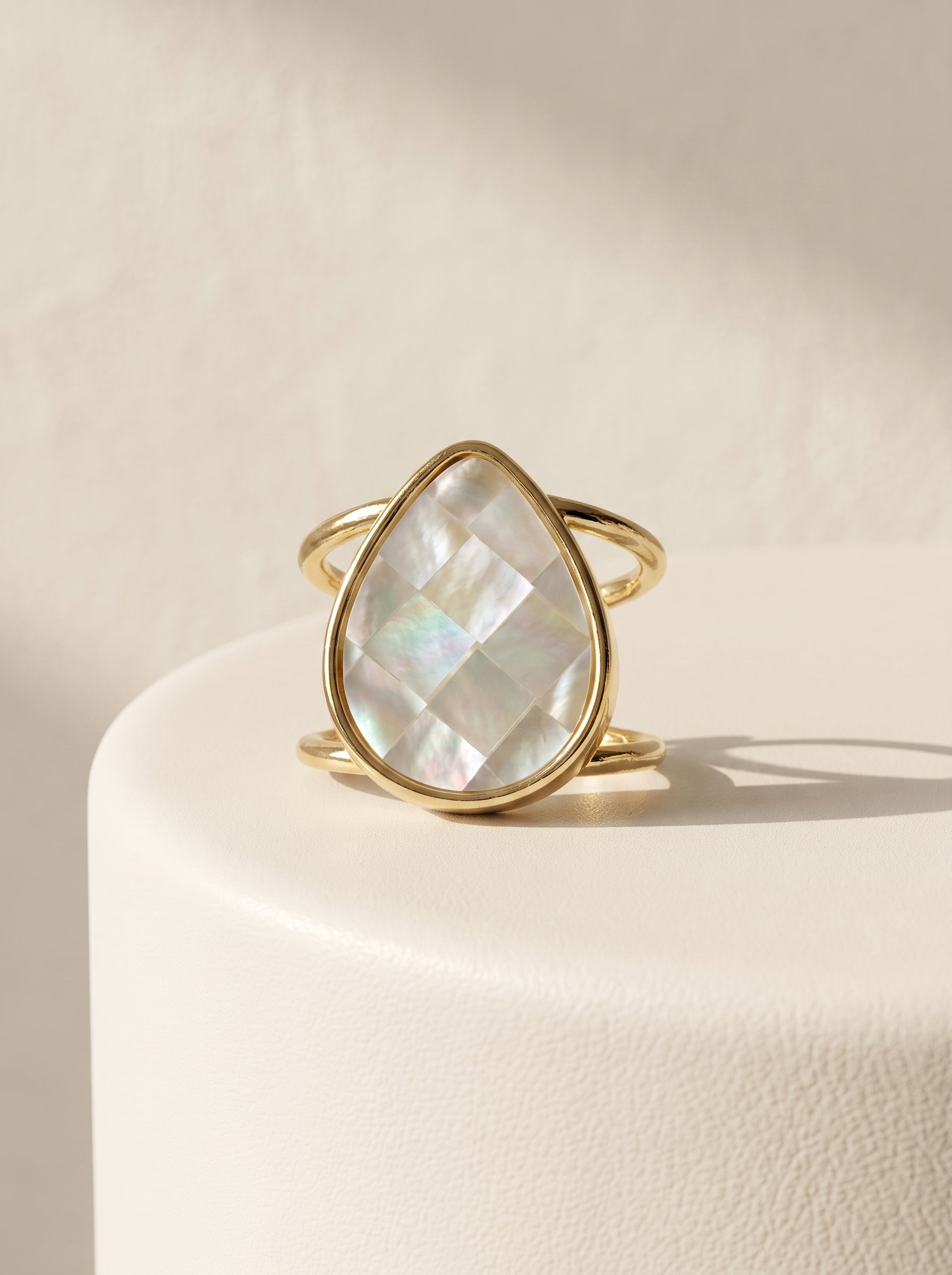 Mother-of-Pearl Teardrop Adjustable Ring front view on white display, iridescent teardrop stone — StoneCraft Jewellery