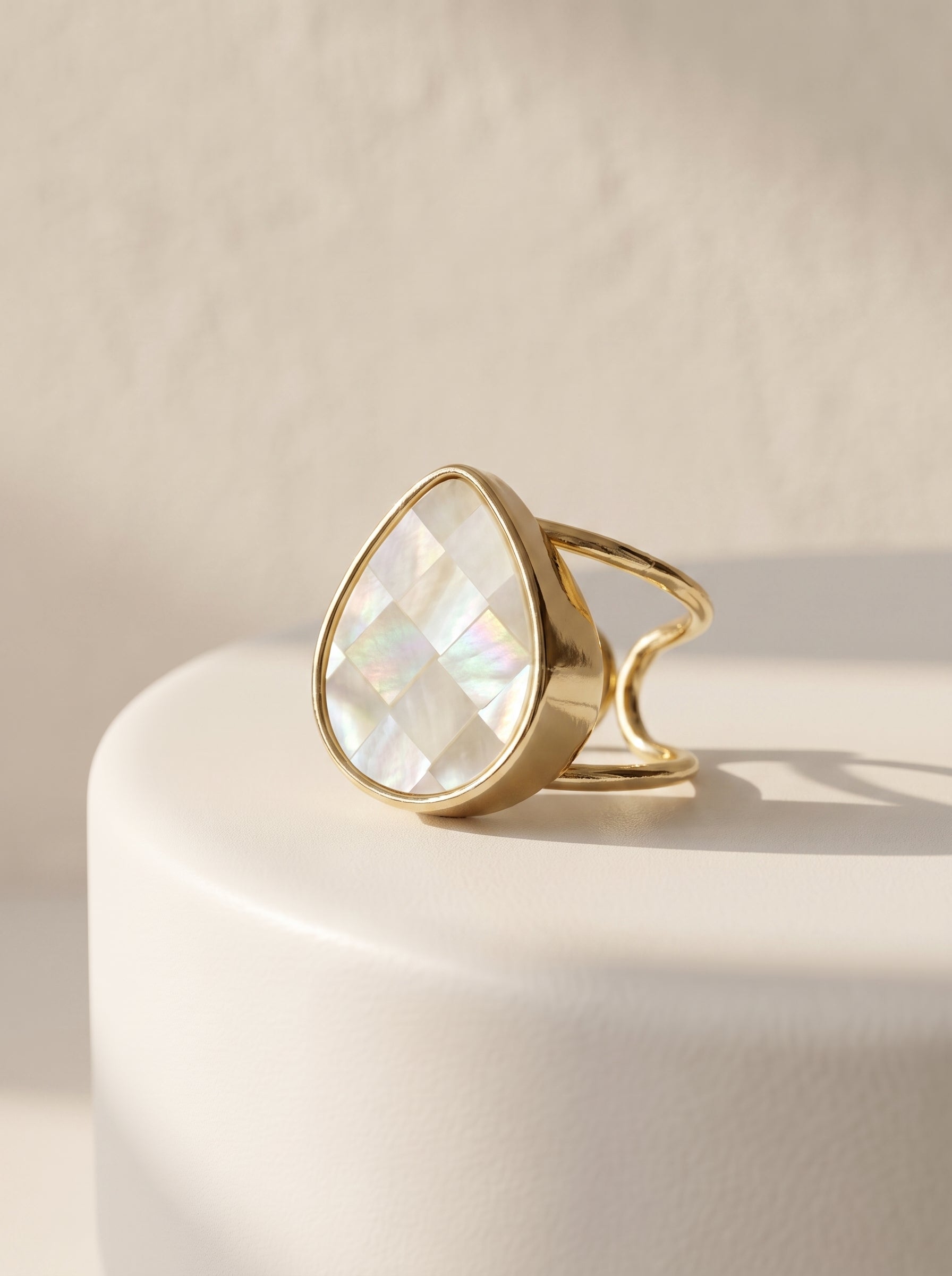 Mother-of-Pearl Teardrop Adjustable Ring side view on white display showing gold band detail — StoneCraft Jewellery