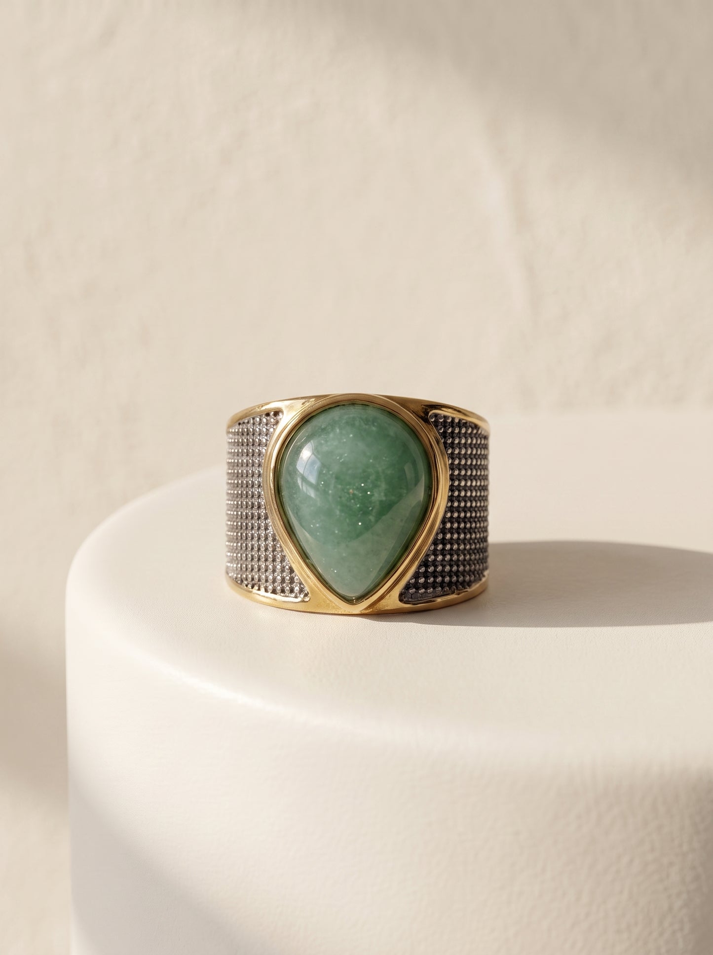 StoneCraft Jewellery green quartz teardrop wide band ring gold white rhodium plated on white surface