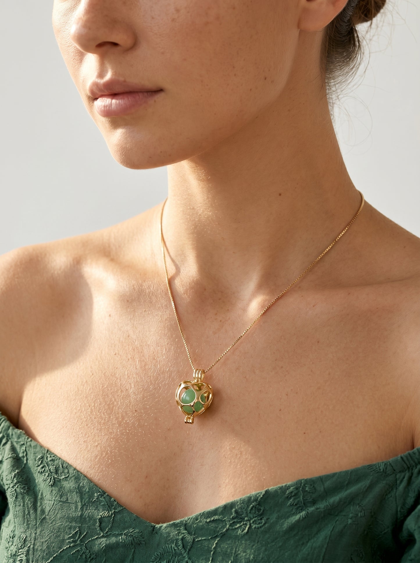 Gold heart locket necklace worn at collarbone, delicate gold-plated chain — StoneCraft Jewellery