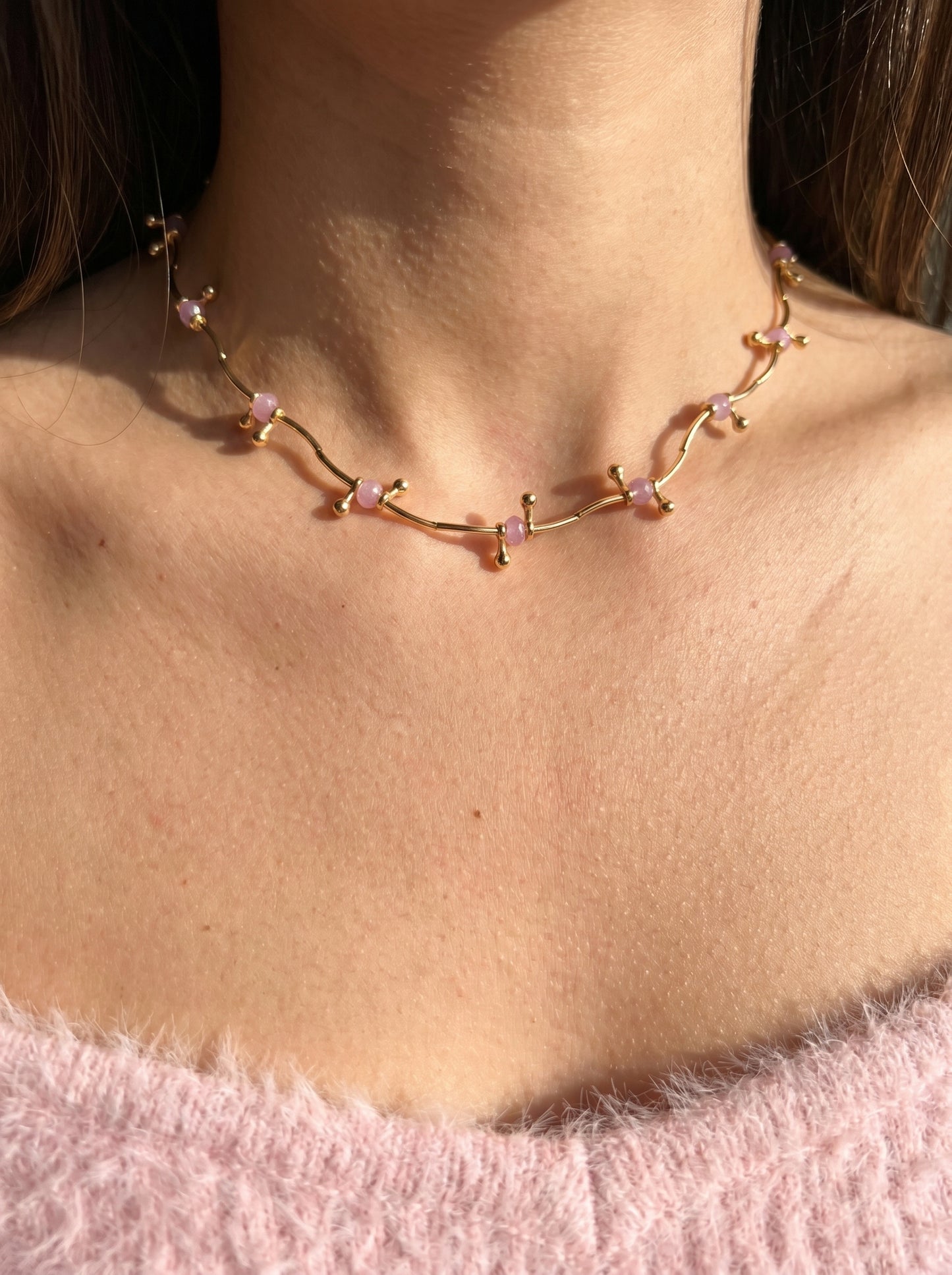 Amethyst choker necklace worn at collarbone, gold-plated delicate vine design