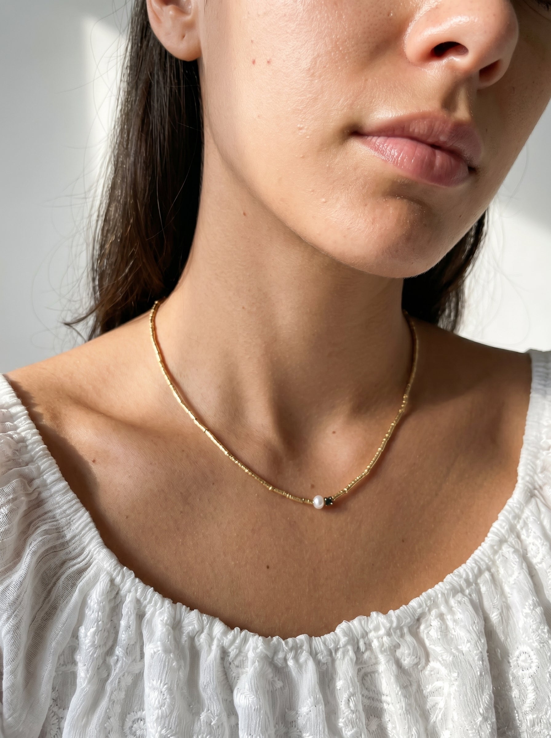 Gold-plated beaded necklace with pearl pendant worn at collarbone — StoneCraft Jewellery