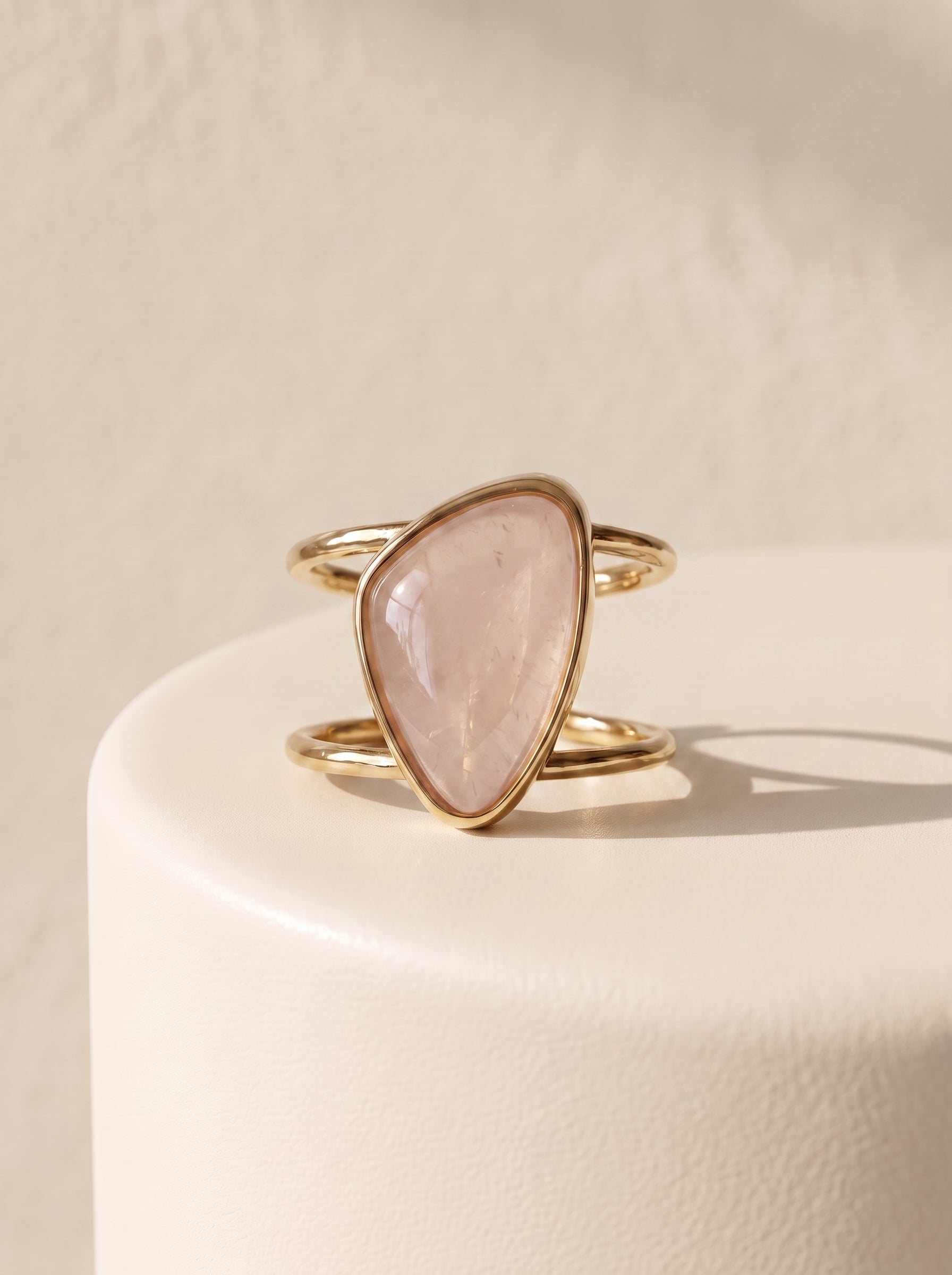Rose quartz asymmetric cuff ring with gold-plated double band, front view – StoneCraft Jewellery
