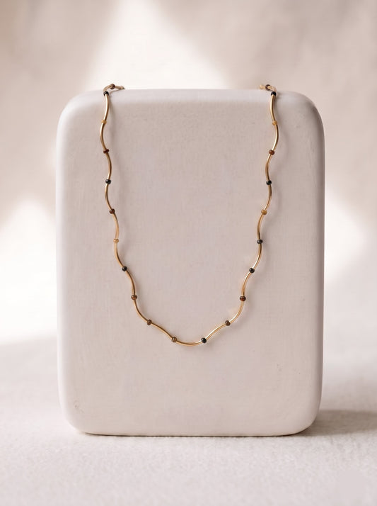 StoneCraft Jewellery Gold Wave Chain Necklace with Tiger's Eye Beads displayed on white jewellery stand
