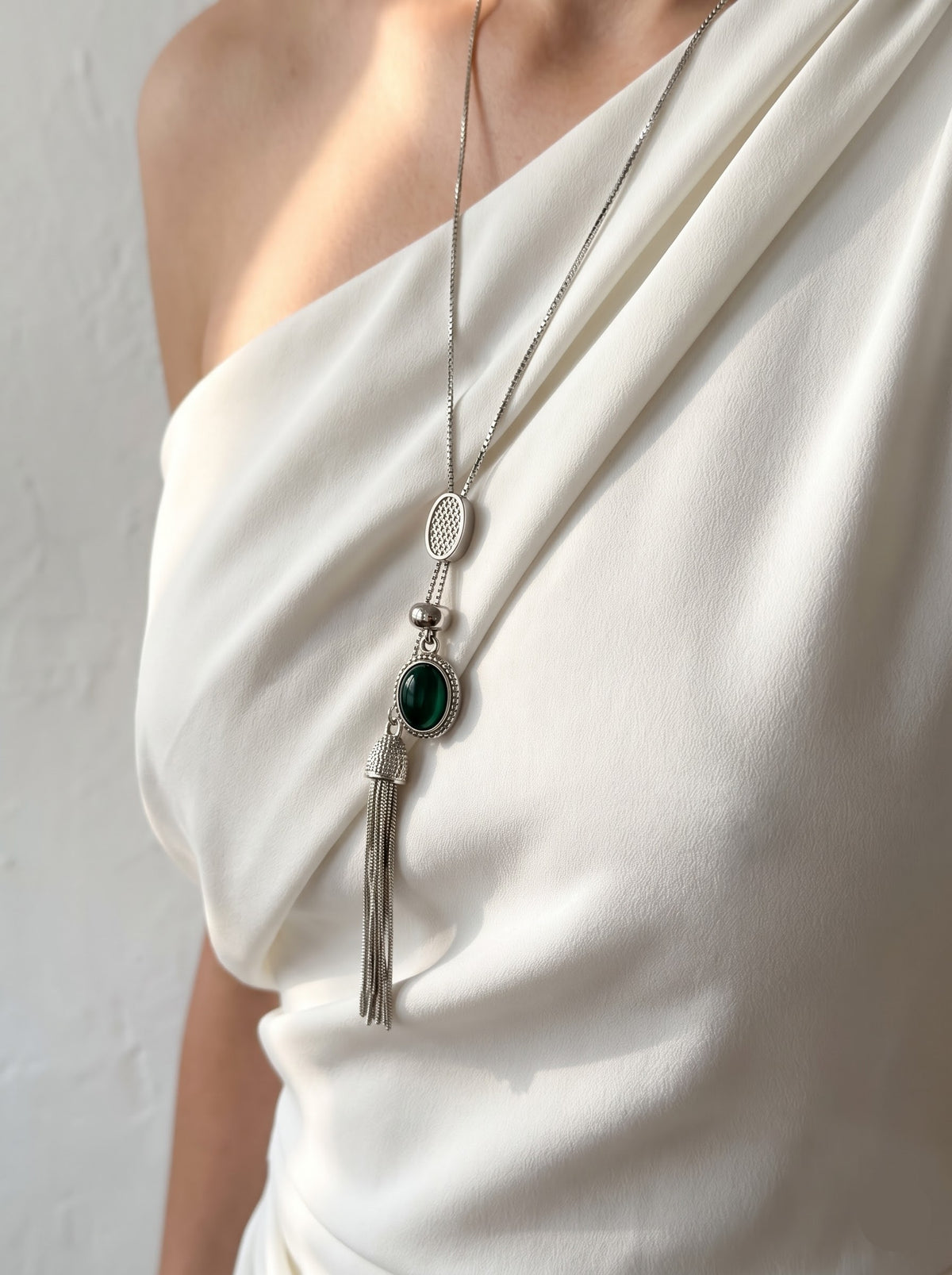 Woman wearing StoneCraft Jewellery Green Agate Silver Tassel Lariat Necklace on white off-shoulder top