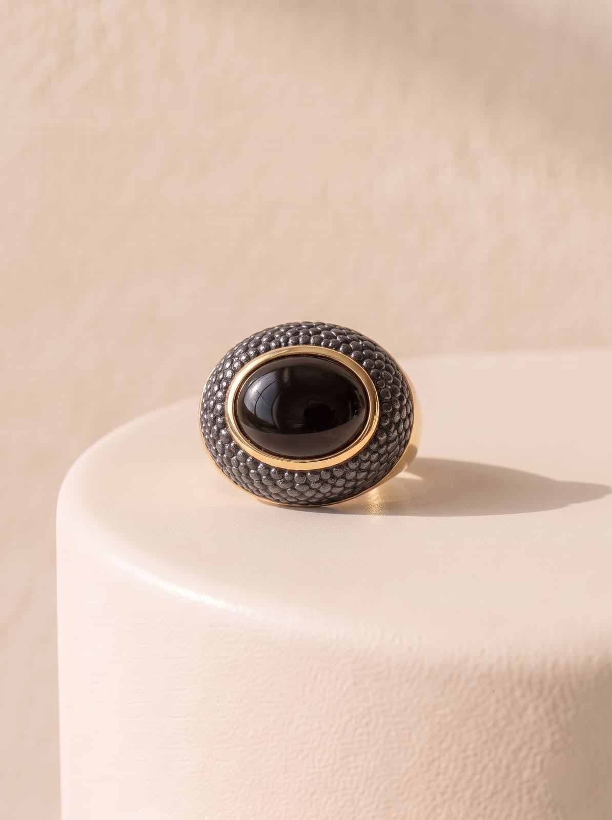 Front view of StoneCraft Jewellery smoky obsidian ring with gold plating and textured black rhodium detail