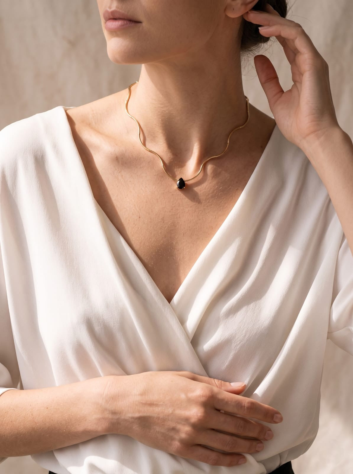 Gold Wave Chain Necklace with Black Teardrop Crystal Pendant