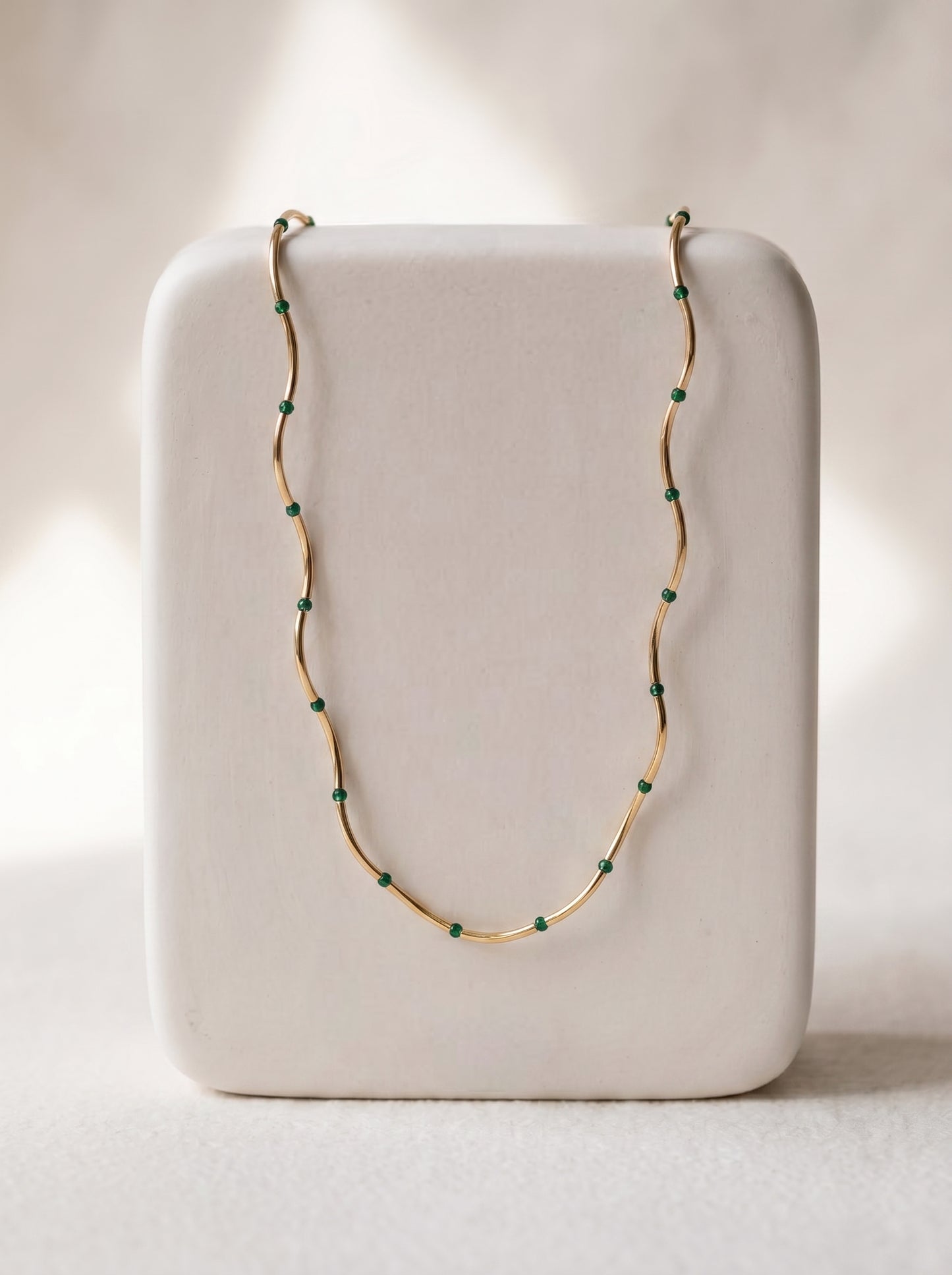 Malachite Bead Chain Necklace gold-plated on white display stand showing full chain with green malachite beads — StoneCraft Jewellery