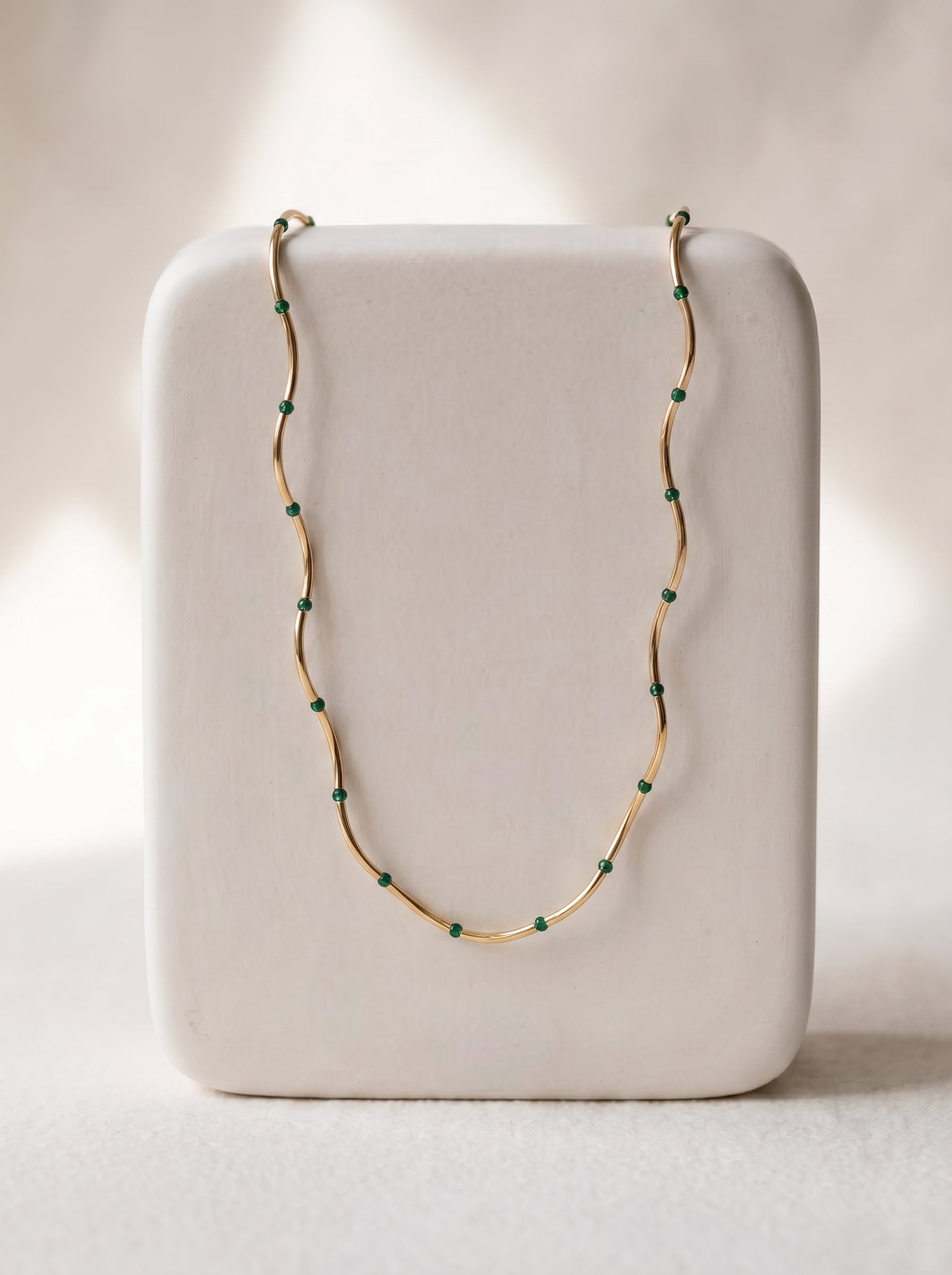 Malachite Bead Chain Necklace gold-plated on white display stand showing full chain with green malachite beads — StoneCraft Jewellery