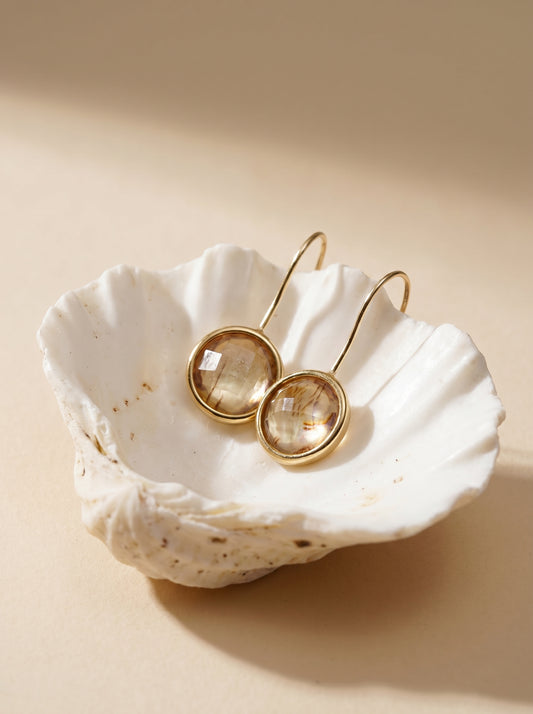 Abalone hook earrings on model, iridescent blues and greens — StoneCraft Jewellery