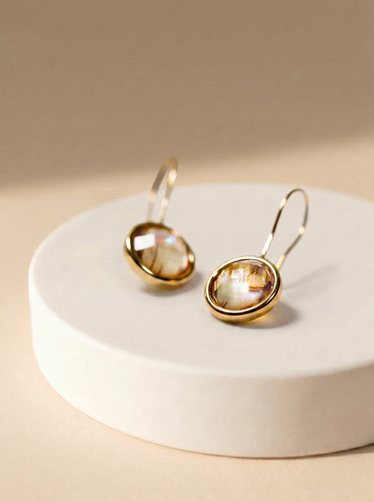 Gold-plated abalone hook earrings lifestyle shot — StoneCraft Jewellery
