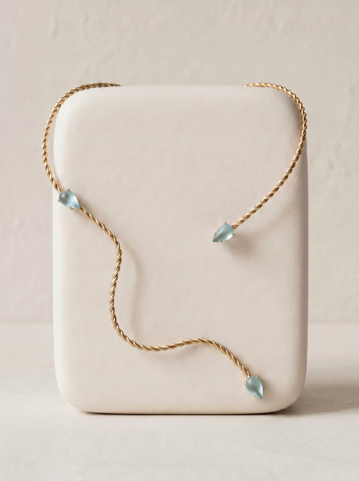 Twisted gold-plated collar necklace with aqua green faceted glass stones, asymmetric design