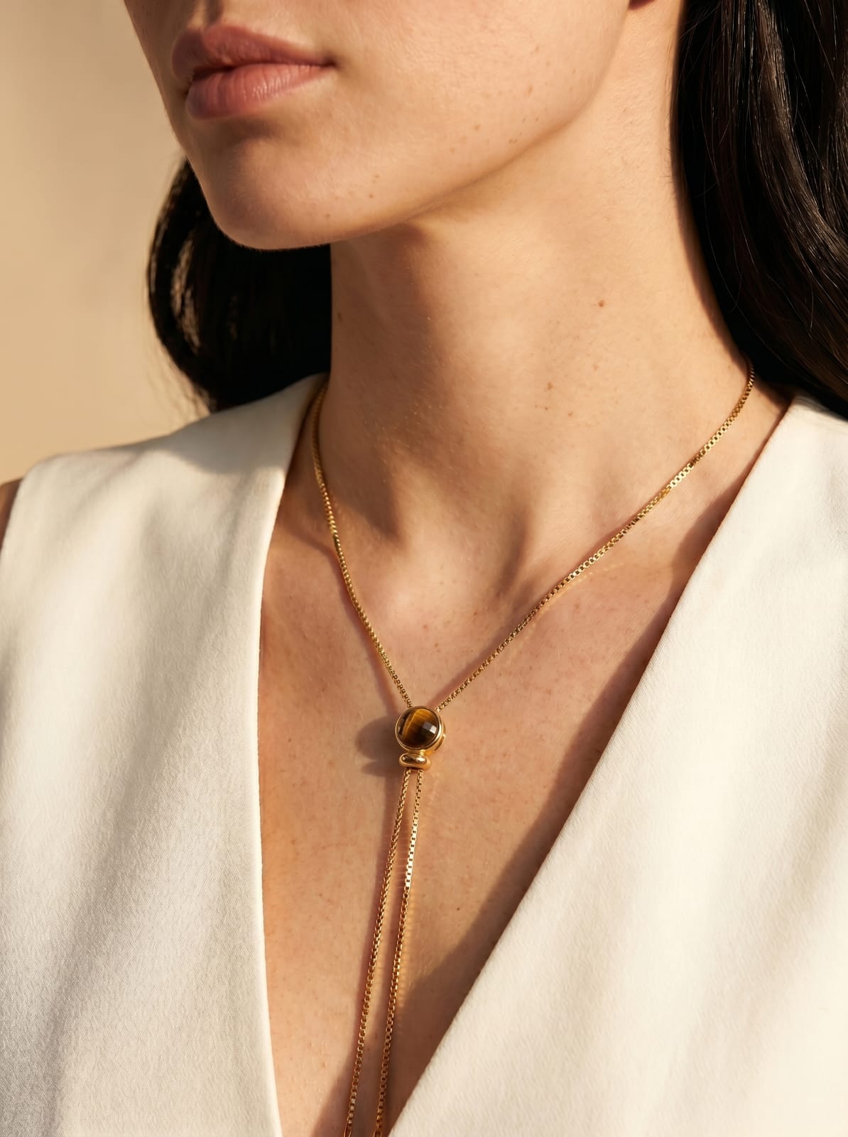 
Tiger's eye lariat necklace worn at front, gold-plated delicate chain — StoneCraft Jewellery